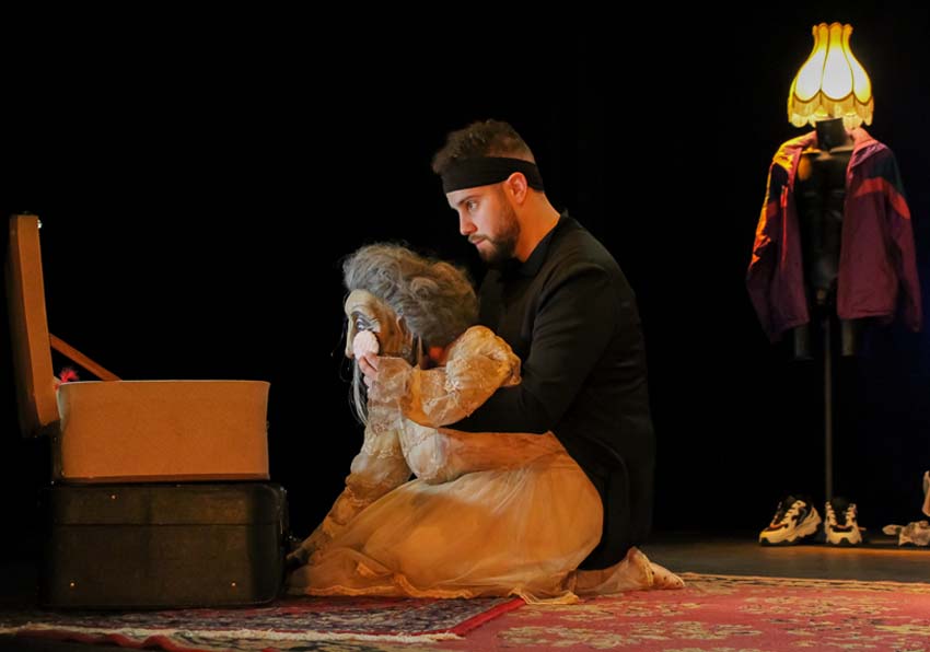 A man with a puppet